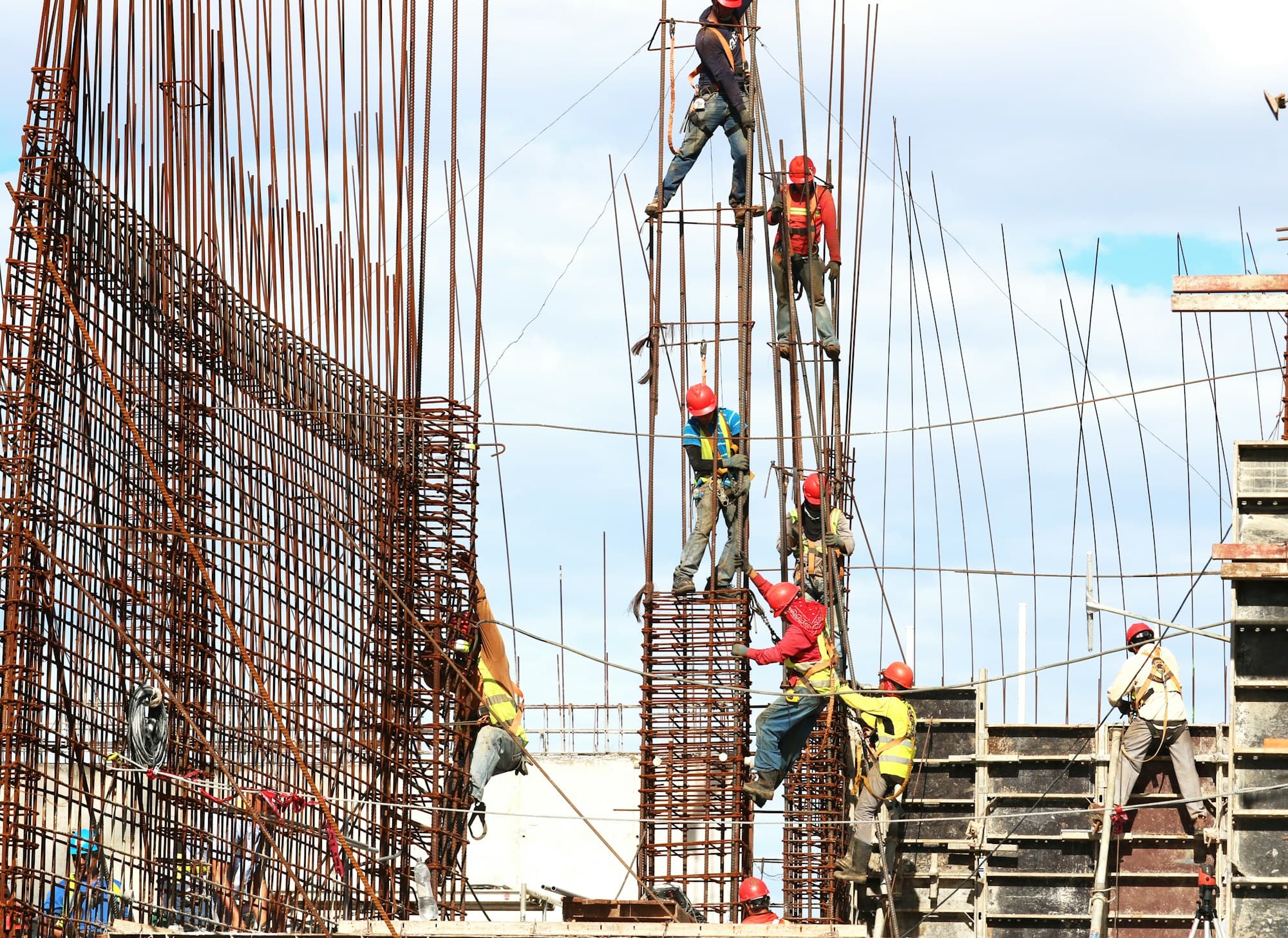 Construction workers on a building site — addressing structural repairs and maintenance common in strata schemes